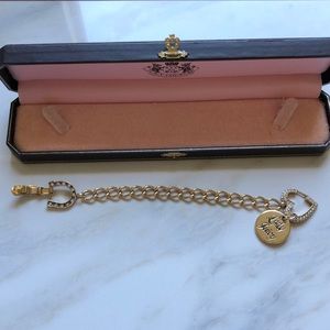 Juicy Couture gold tone bracelet with charms